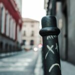 black metal post with sad face paint